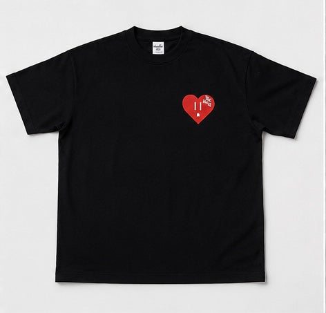 Black t-shirt with a red heart design on a light gray background